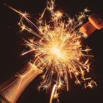 the best sparkling sake in an image like a firework with cork popping